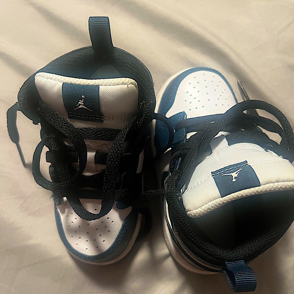 Navy blue and white Jordan 1’s